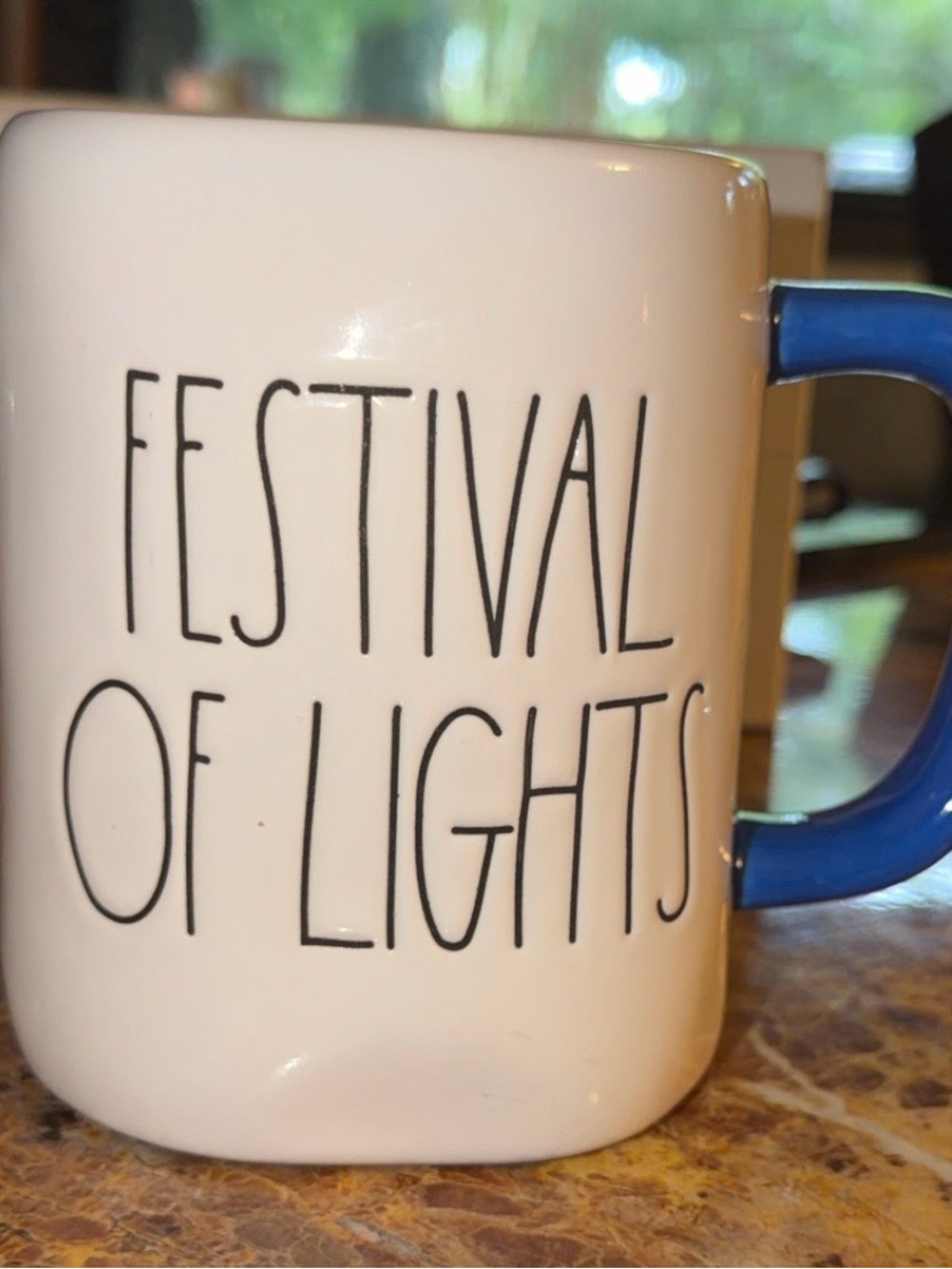 Rae Dunn White Ceramic Mug with Blue Handle - "Festival of Lights"